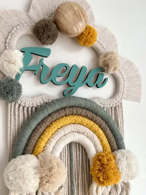 Personalized macramé birth announcement with name, handmade from natural cotton and wooden base.