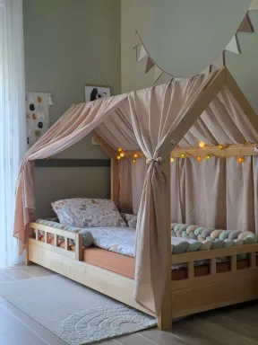 Natural cotton canopy for toddler bed, creating a cozy, dreamy space in a Montessori nursery | YokoTower